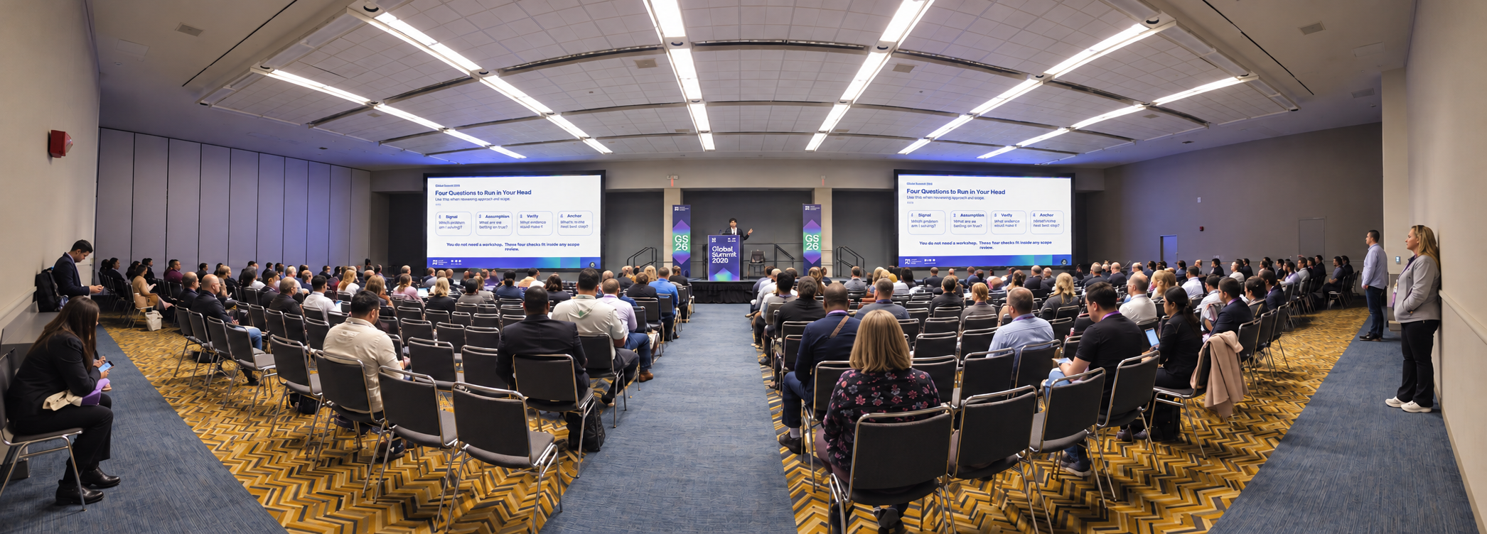 A full breakout room at PMI Global Summit 2026 as Pradeep Billa presents four questions for uncovering hidden assumptions